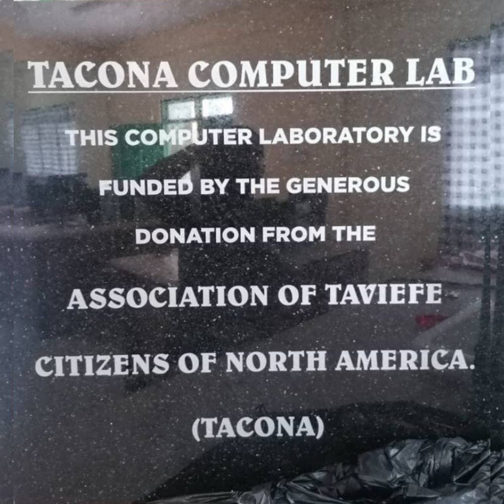 Engraved plaque reading 'TACONA Computer Lab — This computer laboratory is funded by the generous donation from the Association of Taviefe Citizens of North America (TACONA)'